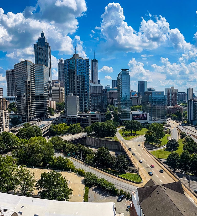 a view of a city with tall buildings in the background