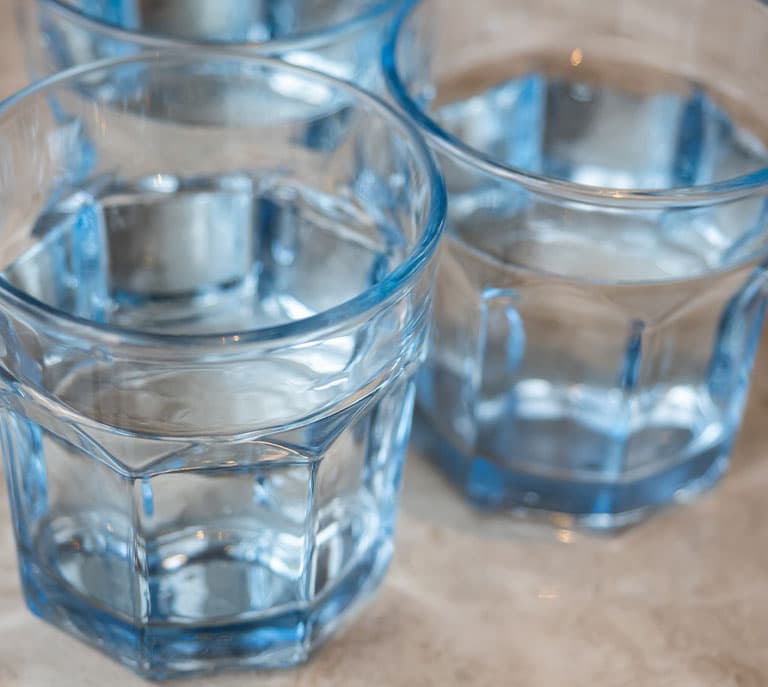a glass of water on a table