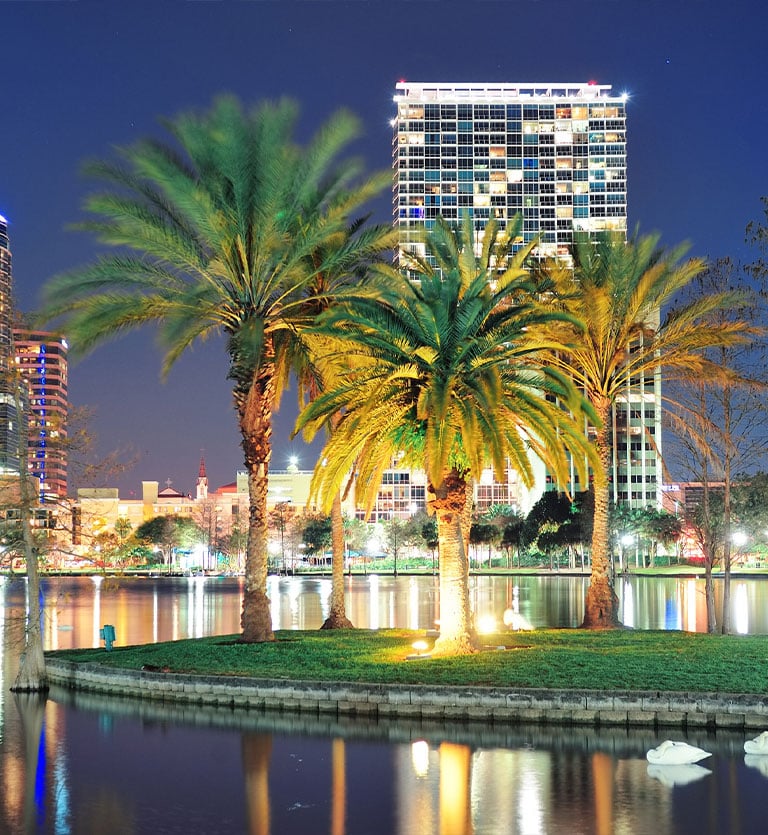 a large building with palm trees